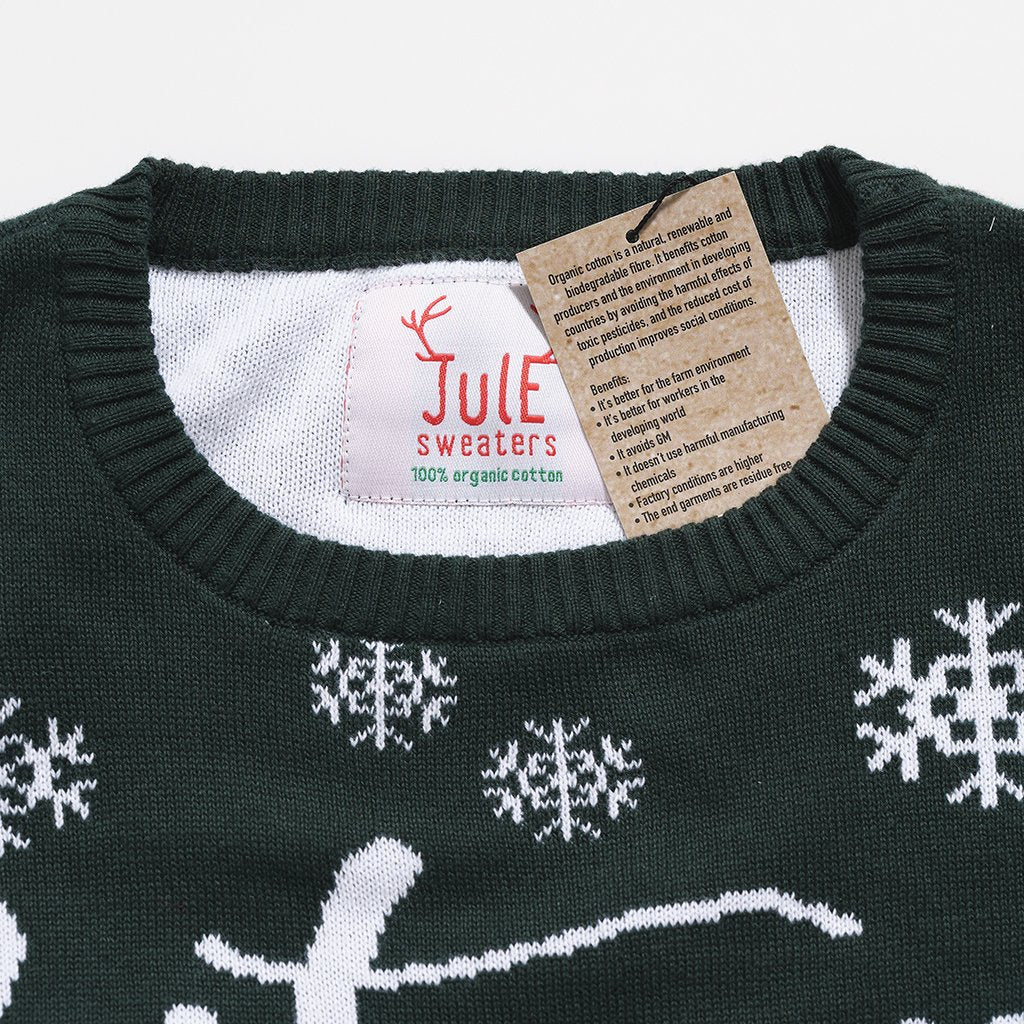 Un pull vert de Noël avec des flocons de neige.